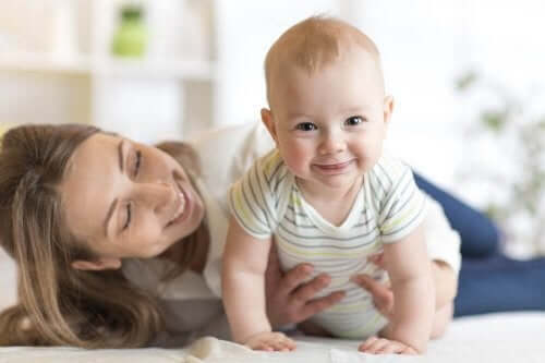 A woman holding a baby.