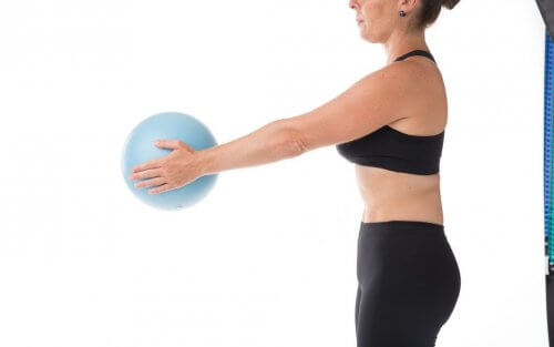 A woman holding a ball.