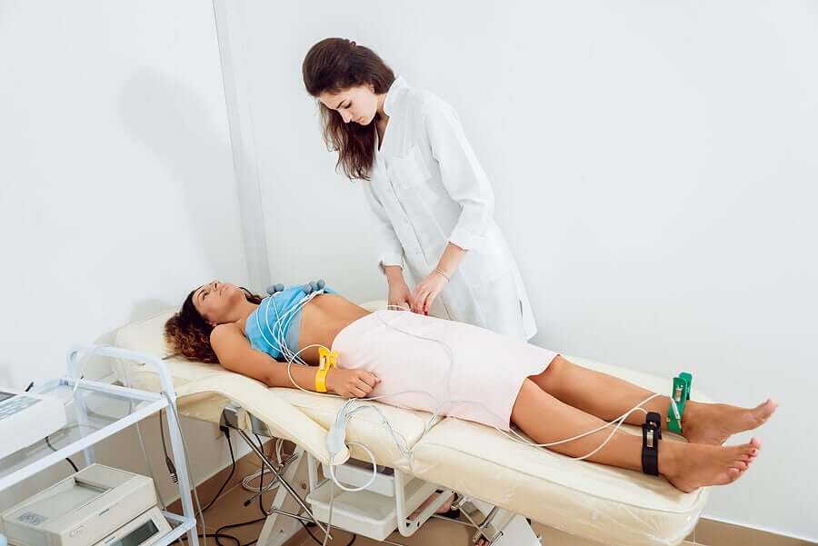 A woman undergoing an EKG.