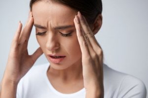 A woman with a headache.
