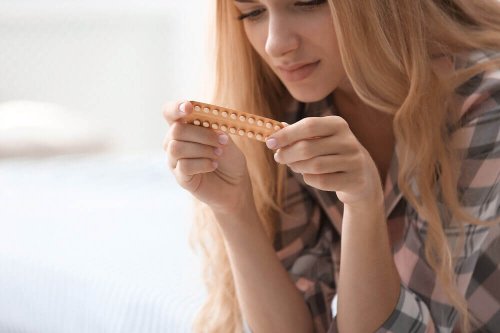 A woman taking oral contraceptives.