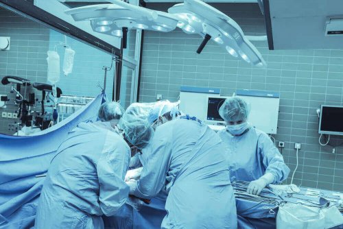 Surgeons performing a hemispherectomy.