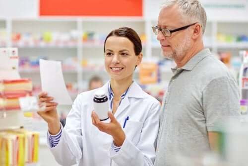 A pharmacist talking to a man.