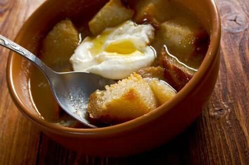 A bowl with an egg and croutons.