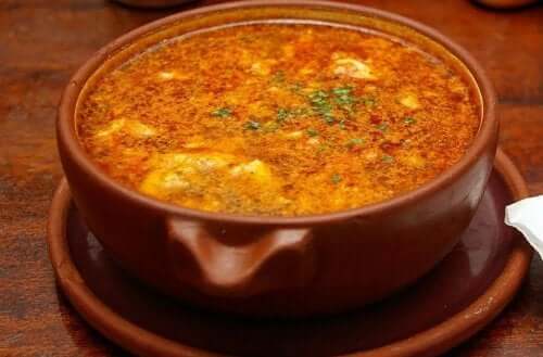 A bowl of garlic and chorizo soup.