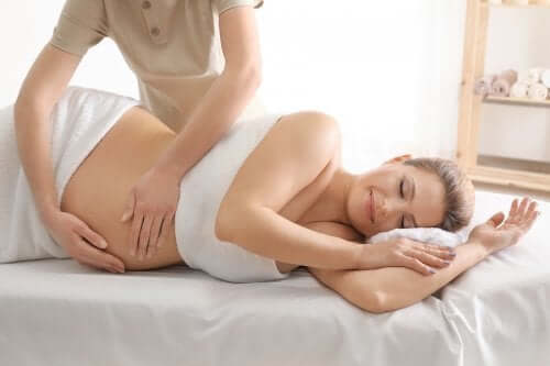 A pregnant woman getting a massage.