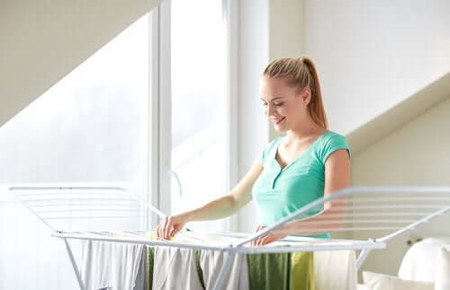 A woman hanging her clothes to dry.