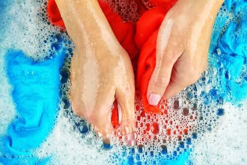 A woman washing clothes by hand.