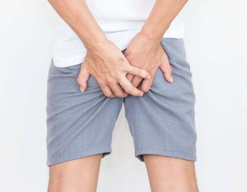 A person holding their bum.