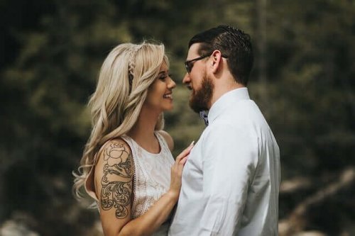 A couple smiling.