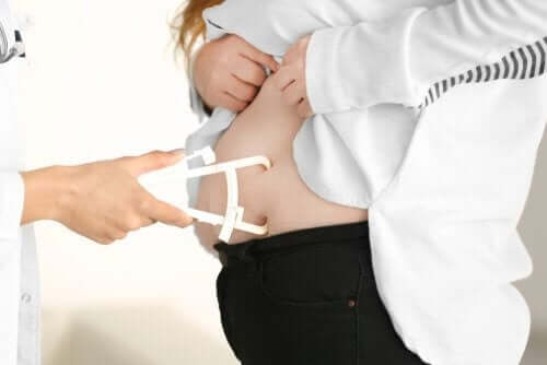 A doctor doing a fat test.