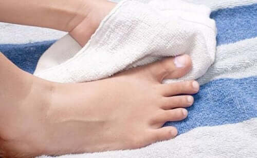 A person drying their feet.