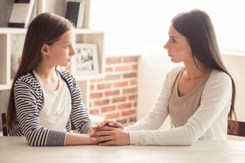 A girl listening to a woman.