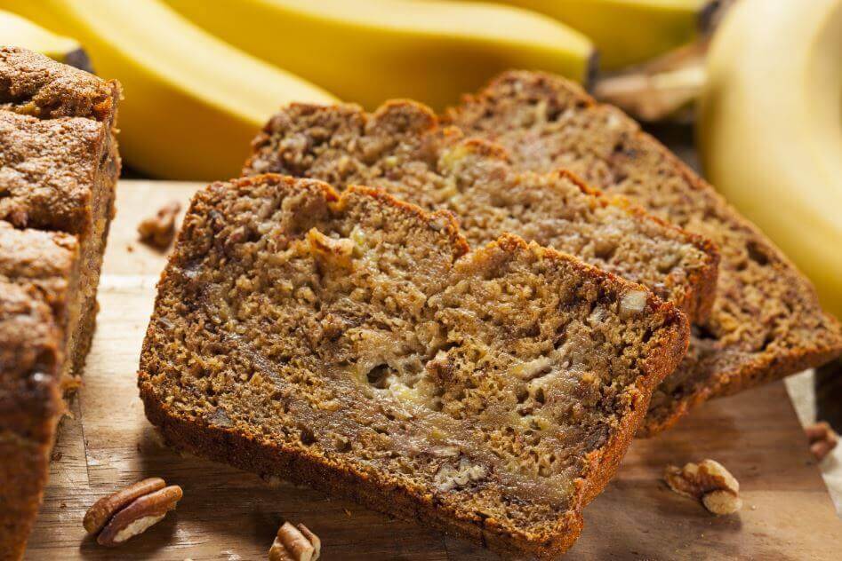 A banana loaf with walnuts.