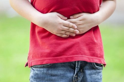 A child holding their stomach.