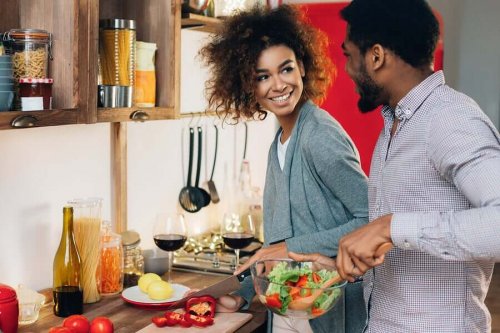 A couple cooking together.