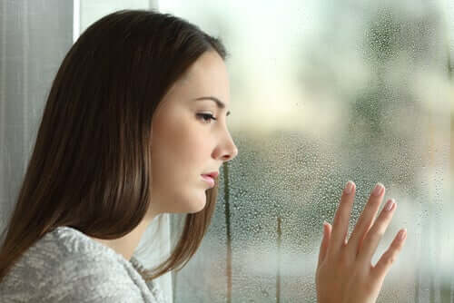 Sad woman looking out the window