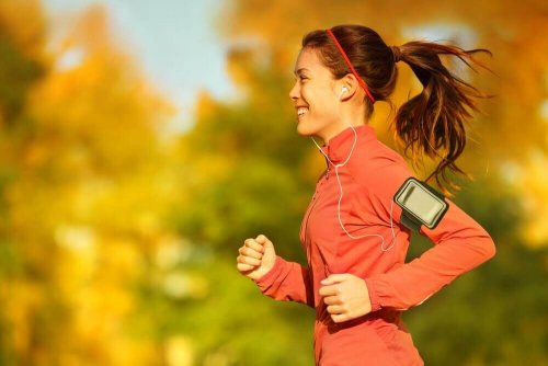 A woman jogging while listening to music.