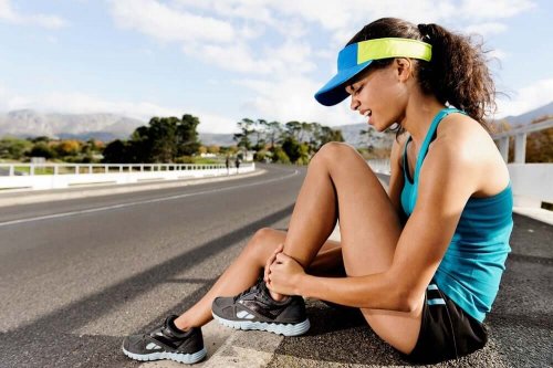 A woman in pain due to exercise injury.