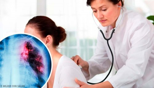 A doctor listening to a woman's lungs.