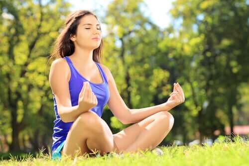 A woman meditating.