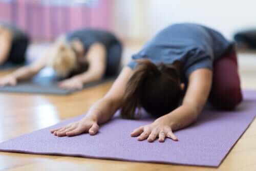 People doing yoga.