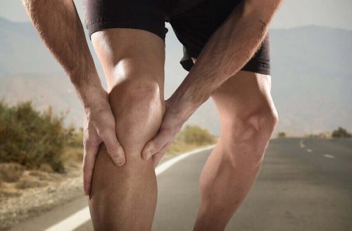 A jogger with cramps in his leg.