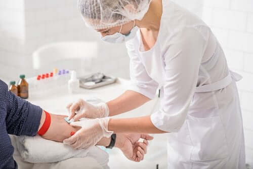 A nurse attending to a patient.