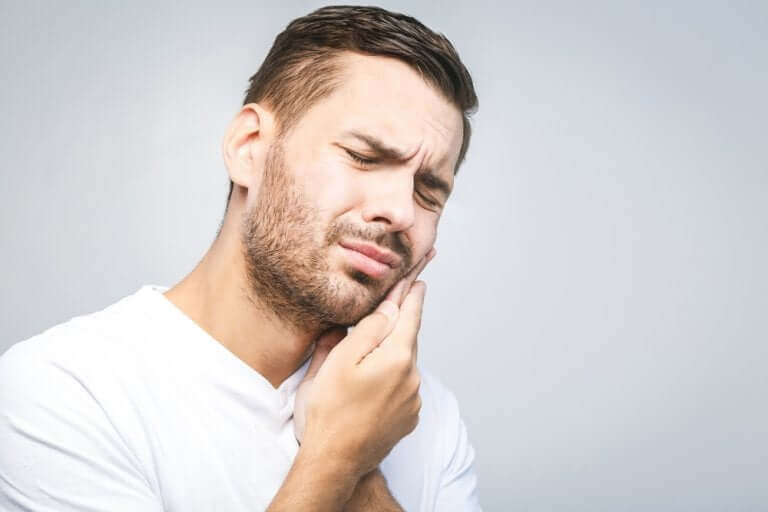 Man with wisdom teeth pain.