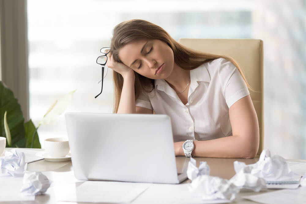 Tired woman suffering from superwoman syndrome.