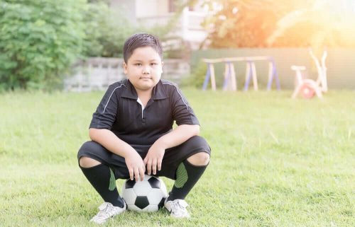 A child playing soccer.