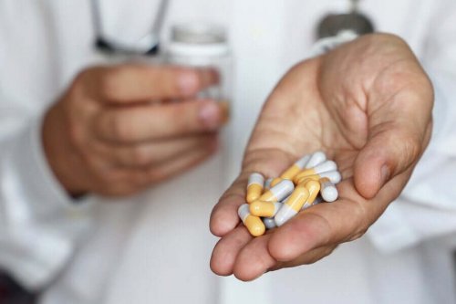 A doctor holding isotretinoin.