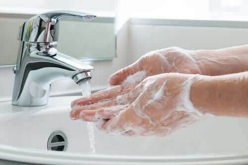 A person washing their hands.