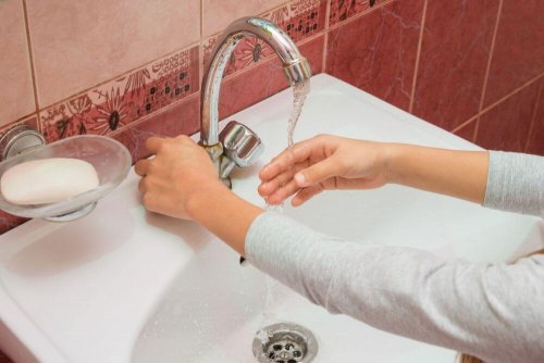 A person washing their hands.
