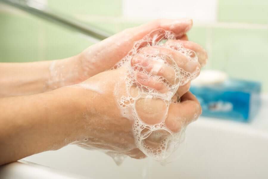 A person washing their hands.