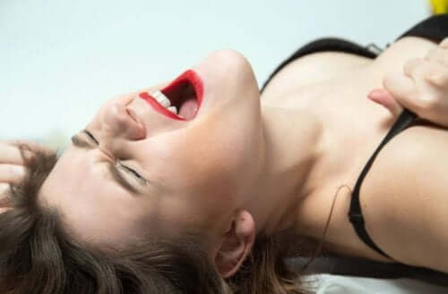 A woman having an orgasm.