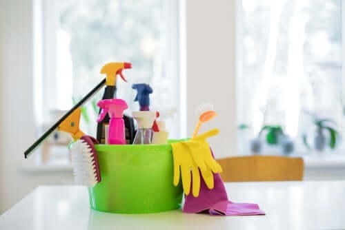Cleaning products in a bucket.
