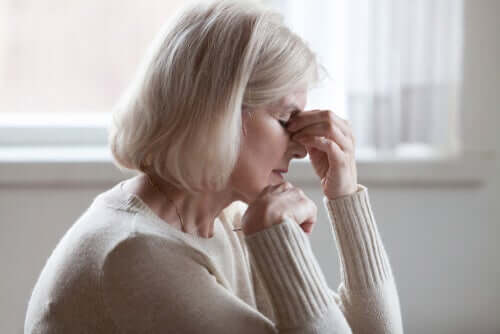 An elderly woman experiencing fatigue.