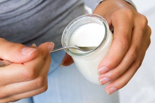 A person eating yogurt.