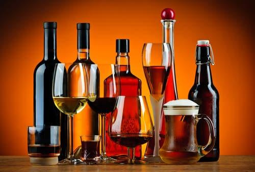 Alcoholic drinks. Drinking a lot can cause high uric acid.