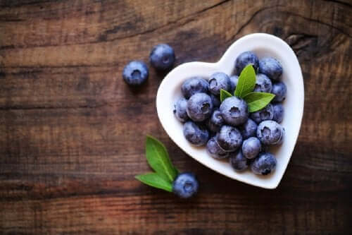 Blueberries in a heart-shaped bowl.