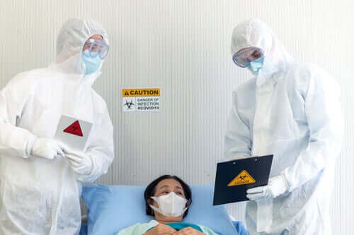 Two doctors with a patient.