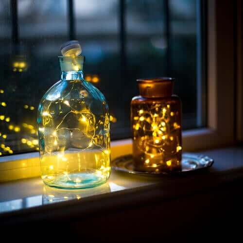 Jar lamps by a window, an eco-friendly decoration idea.
