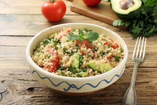 Healthy quinoa and avocado salad in a bowl.