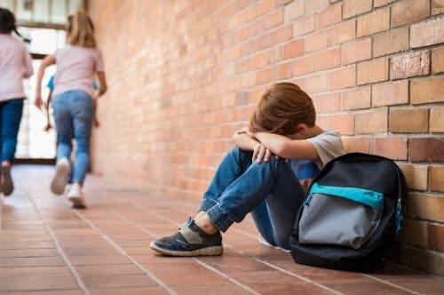 A sad boy in school.