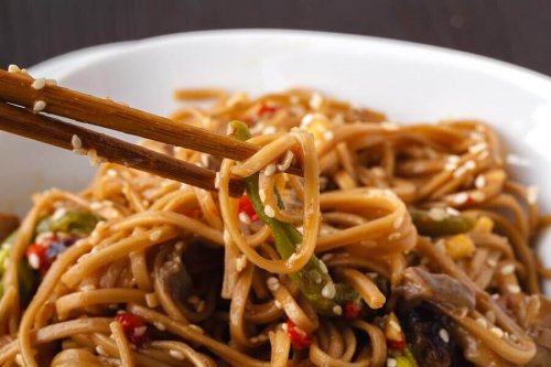 Whole wheat pasta dish with sesame seeds.