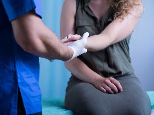 A woman visiting the doctor.