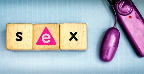 Wood blocks that make the the word "Sex" and a vibrator.