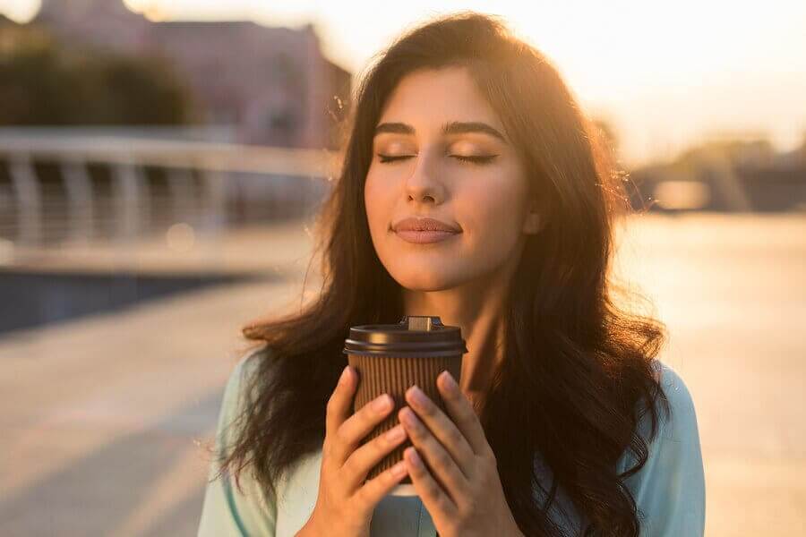 A calm woman drinking coffee.