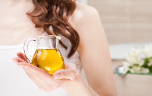 Woman holding a jar of olive oil